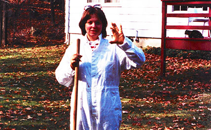 Karen Vanderhoof-Forschner holding a vial of ticks